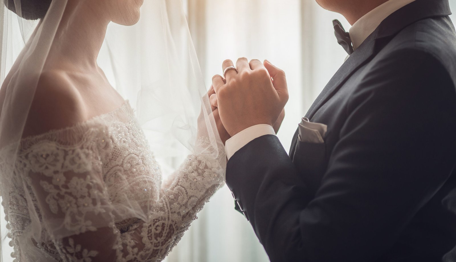 Holding Hands with wedding rings